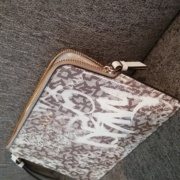 Brand new DKNY medium wristlet. Brown Graffiti pattern. Retails $78 - Picture 9 of 9